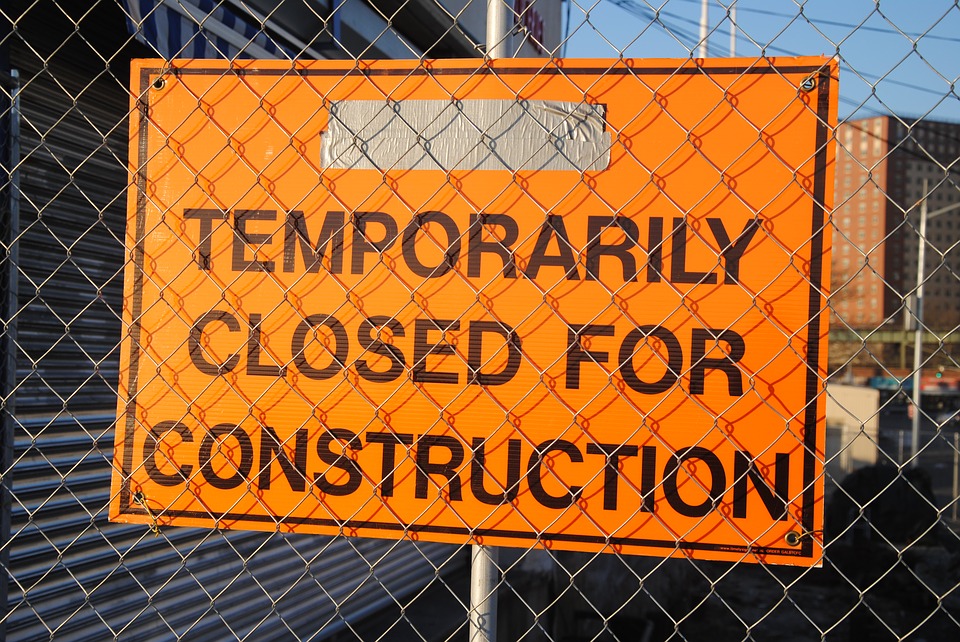 Construction site sign reading temporarily closed for construction